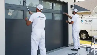 Professional garage door painting in Buffalo, NY by expert residential house painters